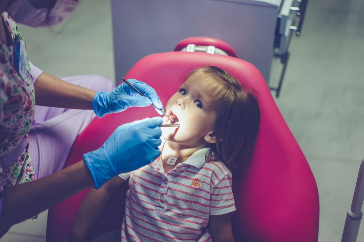 Pediatric dentist caring for baby teeth at Abilene pediatric dental